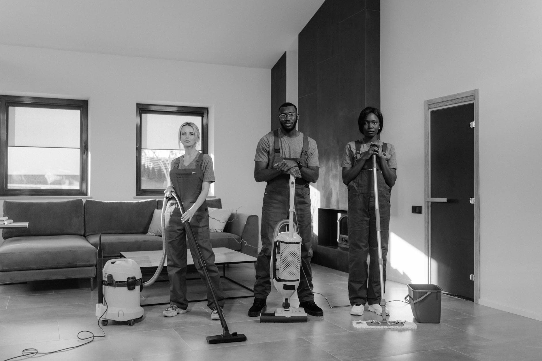 Three professional NYC Maid cleaners in uniform with equipment, ready for a job — Move-In/Move-Out Cleaning in Locust Point, Bronx